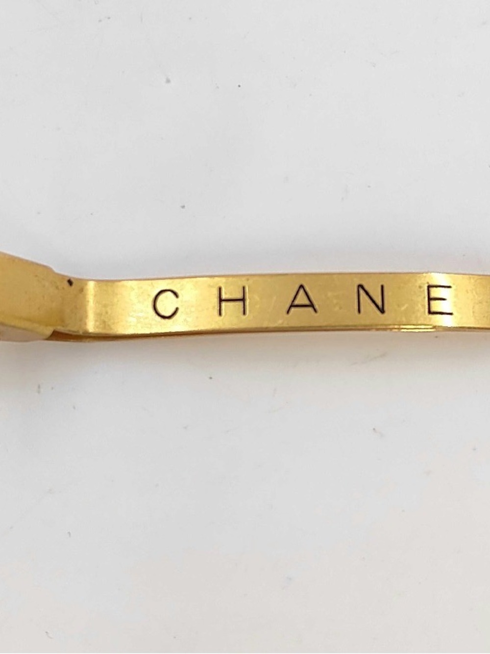 CHANEL Gold Tone Logo Hair Barrette